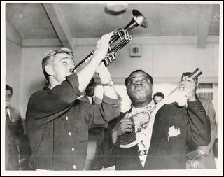 [Jazz & Song] Armstrong, Louis. (1901–1971) Original Photograph Performing on a Tennis Racket