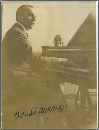 Arrau, Claudio. (1903–1991) Early signed photograph at piano