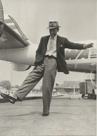 Astaire, Fred. (1899–1987) Original Photograph dancing en route to French premiere of "Funny Face"