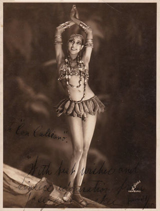 Baker, Josephine. (1906–1975) Signed Photograph - An exotic portrayal in her Banana Skirt