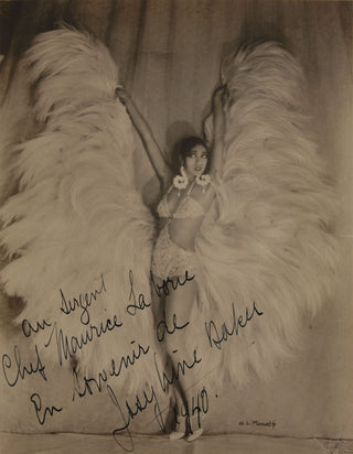 Baker, Josephine. (1906–1975) Signed Photograph in an Exotic Feather Costume