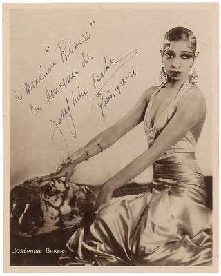 Baker, Josephine. (1906–1975) Large Signed Photograph - An exotic portrayal on a Tiger Skin Rug