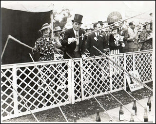 Coward, Noël. (1899-1973) Pair of Photographs "Fishing for Champagne."