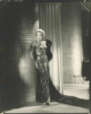 Dietrich, Marlene (1901-1992) [Engstead, John. (1912–1984)] Portrait Photograph in a Jean Louis "nude" gown.