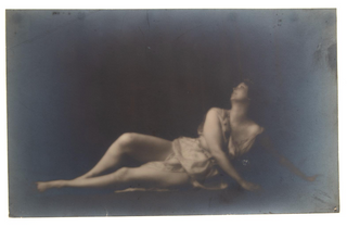 Duncan, Isadora. (1877–1927) [Genthe, Arnold (1869–1942)] Isadora Duncan in Reclining Dance Pose - Original Photograph