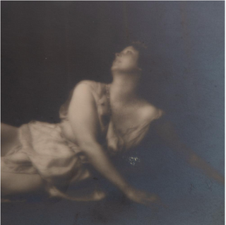 Duncan, Isadora. (1877–1927) [Genthe, Arnold (1869–1942)] Isadora Duncan in Reclining Dance Pose - Original Photograph