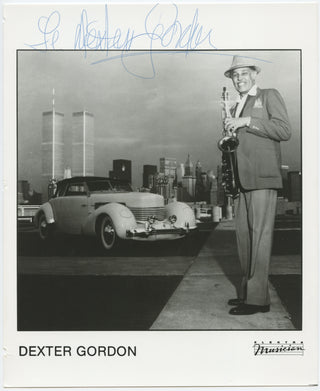 Gordon, Dexter. (1923-1990) Signed Photograph with the Twin Towers and a Classic Car