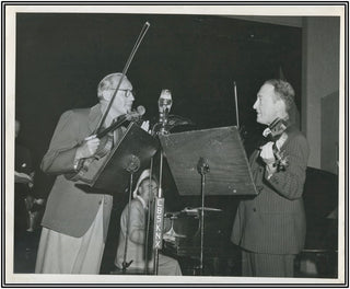 Heifetz, Jascha. (1901–1987) Original candid photograph with Jack Benny