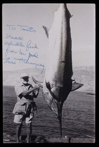 [Literature & Art] Hemingway, Ernest. (1899 - 1961) Signed Photograph during filming of "Old Man and the Sea," inscribed to Toots Shor