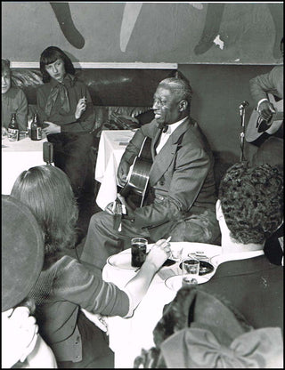 [Jazz & Song]["Lead Belly"] Ledbetter, Huddie William. (1888 - 1949) Jumbo Photograph at the Vanguard Club, 1949