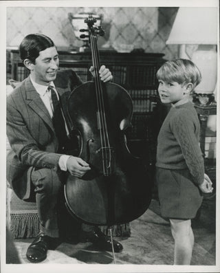 [Cello] Charles, Prince of Wales. (b. 1948) & Prince Edward, Earl of Wessex (b. 1964) Original Press Photograph Holding a Cello