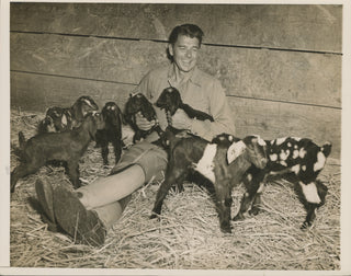 Reagan, Ronald. (1911–2004) "Got His Goat" - Press Photograph with his new litter of goats.