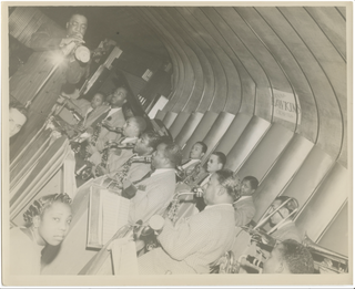 Hawkins, Erskine. (1914–1993) Photograph of the trumpeter performing with his orchestra