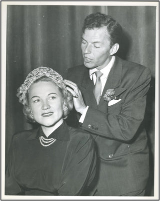 Sinatra, Frank. (1915–1998) Unusual Original Photograph, styling the hair of Dorothy Kirsten!