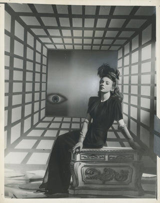 [Surrealism] Lupino, Ida. (1918–1995) [Welbourne, Scotty. (1907-1979)] "It Is Doubtful If Ida Lupino Can Explain Why a Hollywood Cameraman Took Her Picture Against a Surrealistic Backdrop" - Portrait Photograph